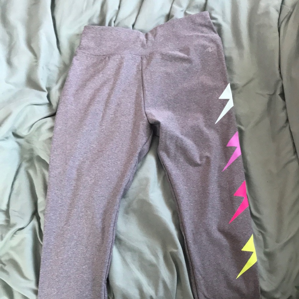Grey athletic leggings with lightning bolts